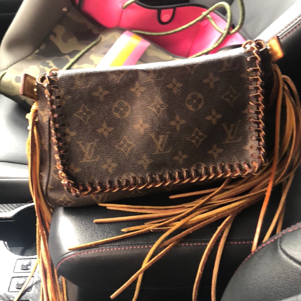 Louis Vuitton leather fringed and braided handbag